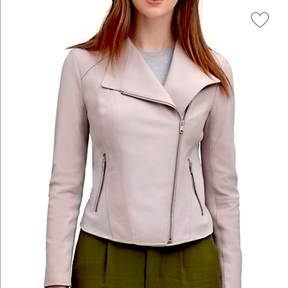 Never worn leather jacket in a light tan color. Slim fit with silver zippers.